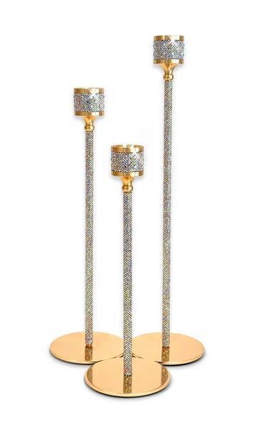 Three gold and silver rhinestone candlesticks of different heights arranged on a white background.