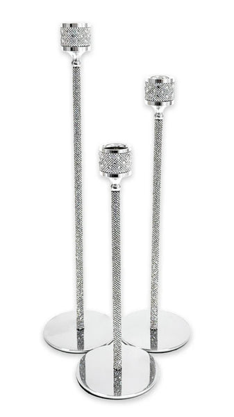 Three silver candlestick holders of graduated sizes with textured crystal-like details on the stems and circular bases, set against a plain white background.