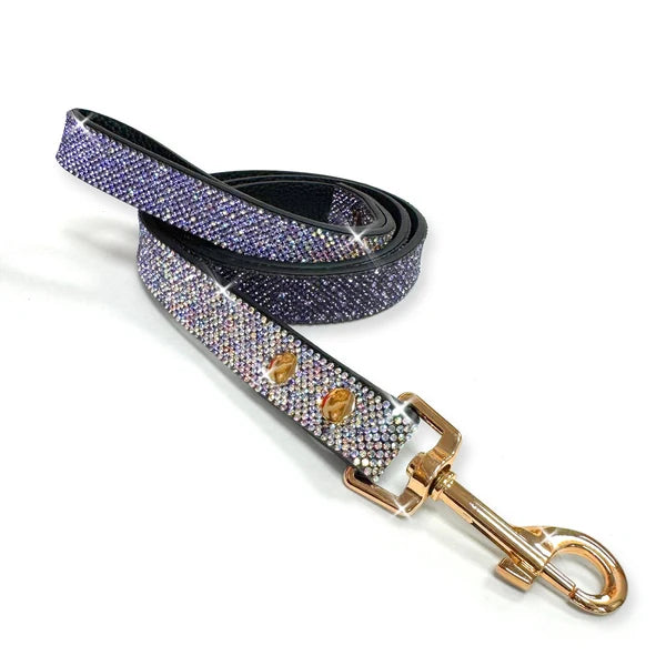 a faux leather black leash embedded with purple and silver crystals and a gold swivel clasp